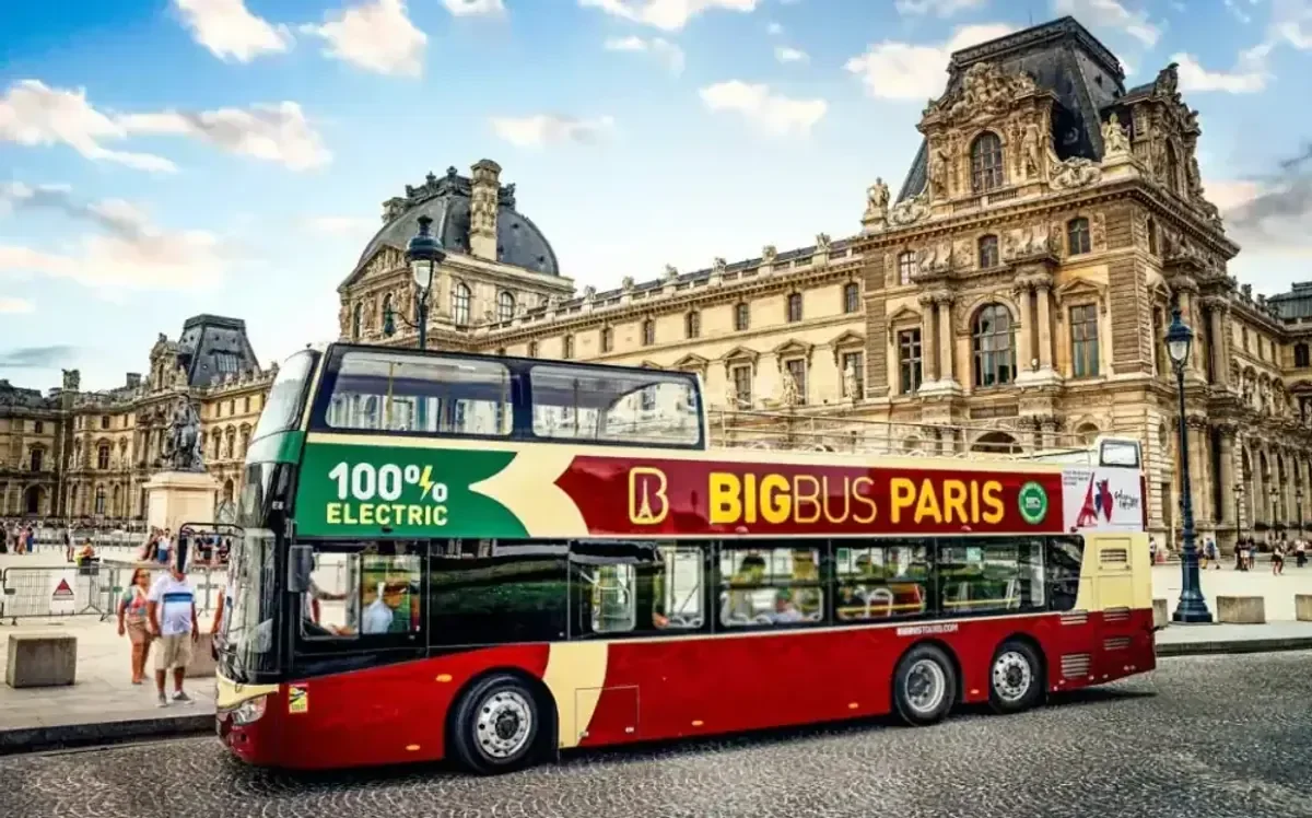 An open-top sightseeing bus in Paris An open-top sightseeing bus in Paris